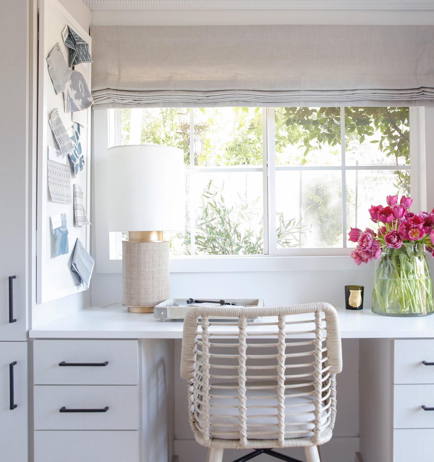 Home office with small desk and shelving by California Closets