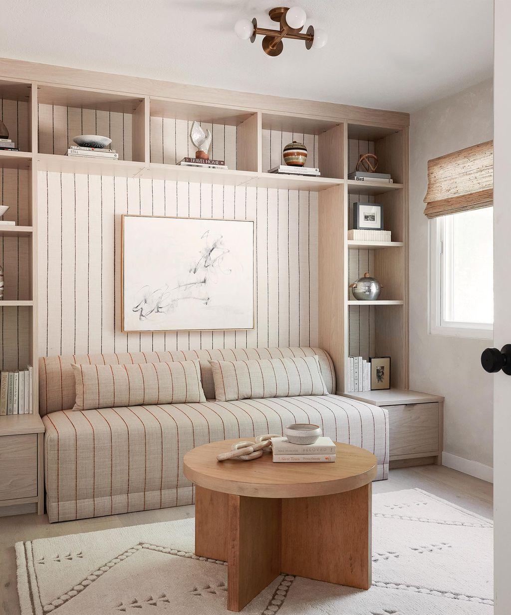 Den furniture with bookshelves, daybed and specialty lighting by Calfornia Closets