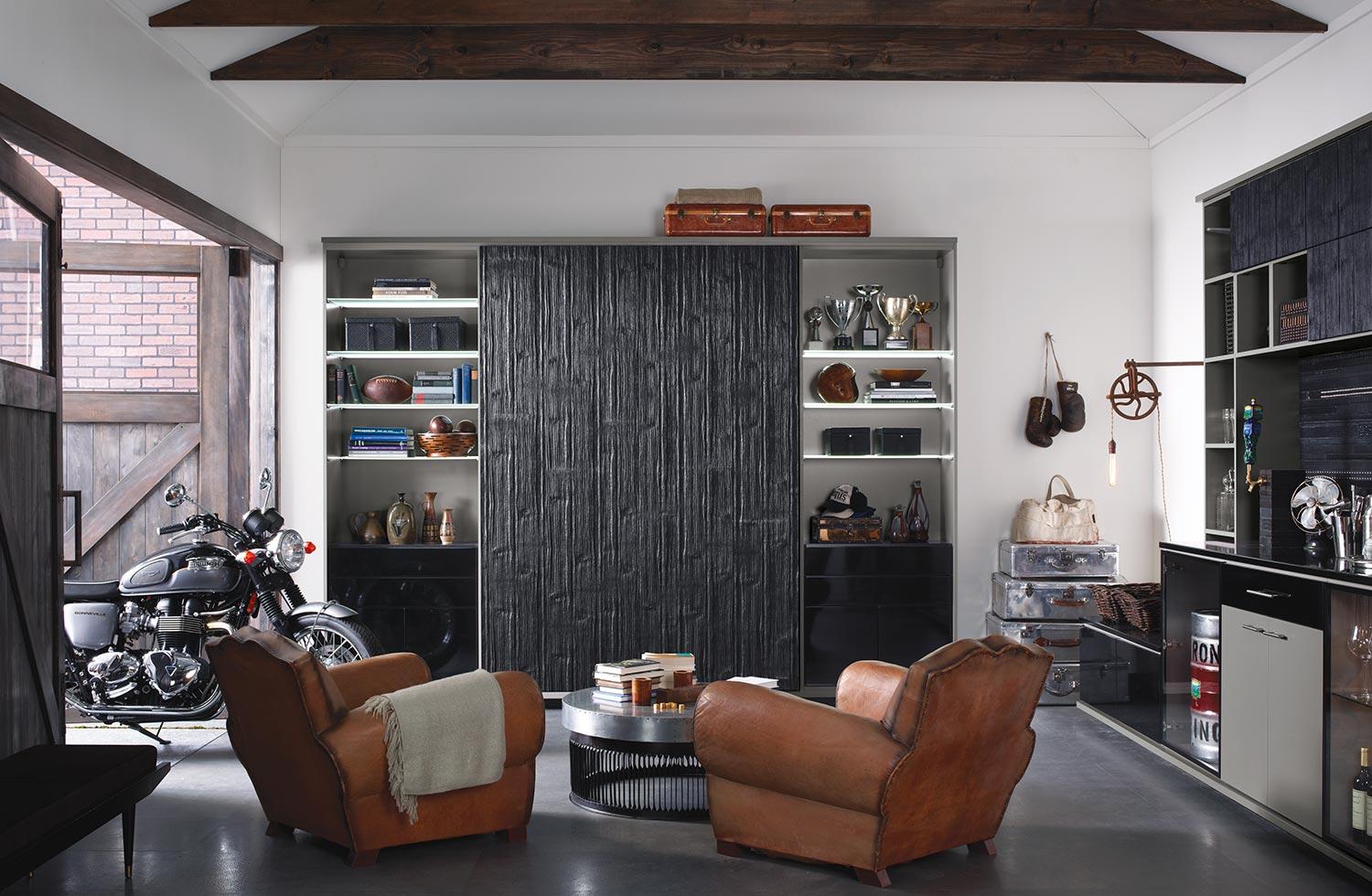 Custom home solutions for your garage transformed in to a man cave with entertainment center and home bar by California Closets