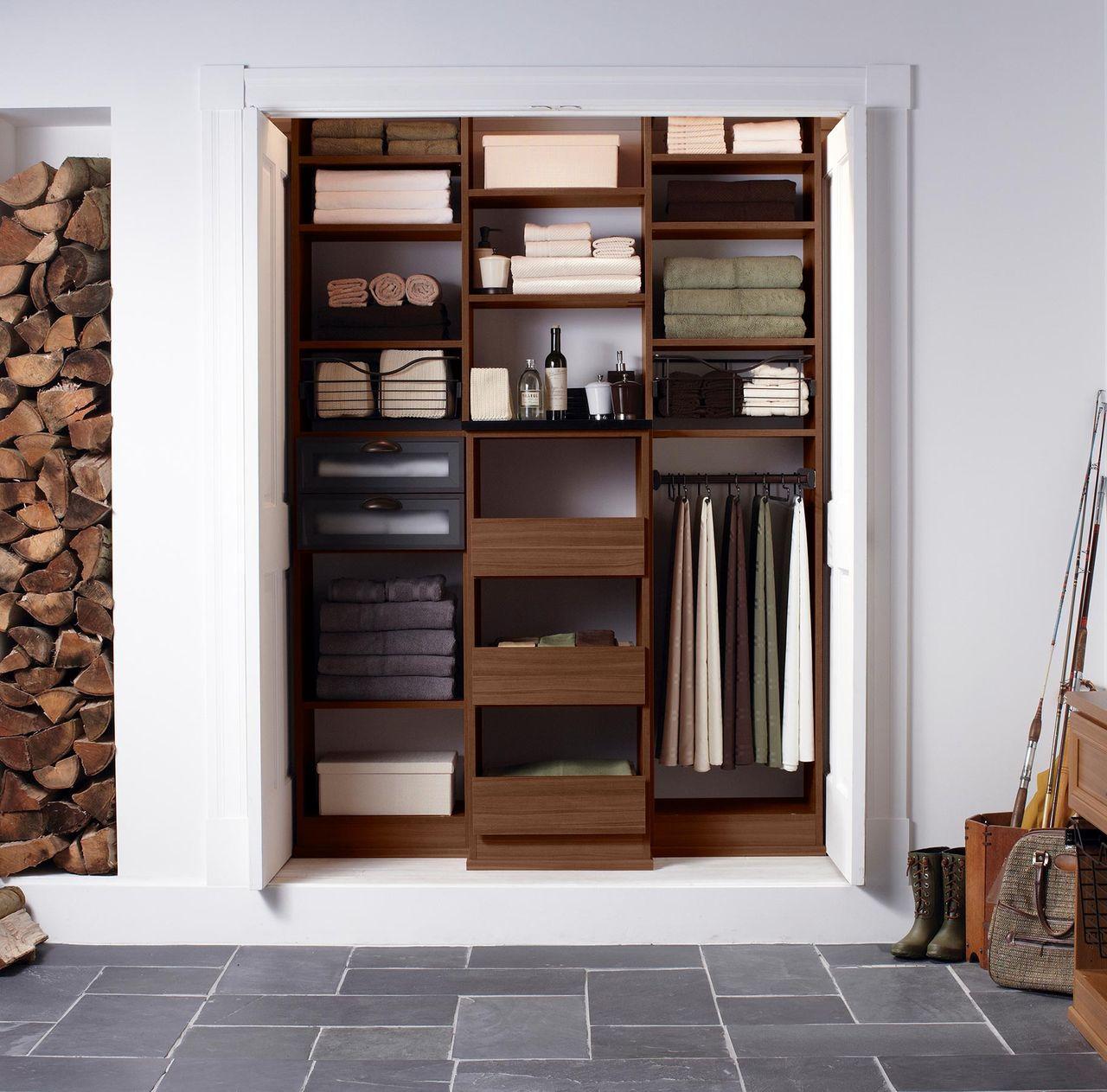 Mudroom closet design ideas shown in dark wood finish by California Closet