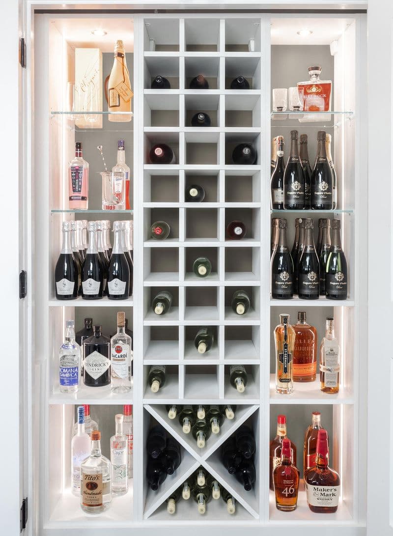Pantry with wine storage x-shelving and custom lighting from California Closets